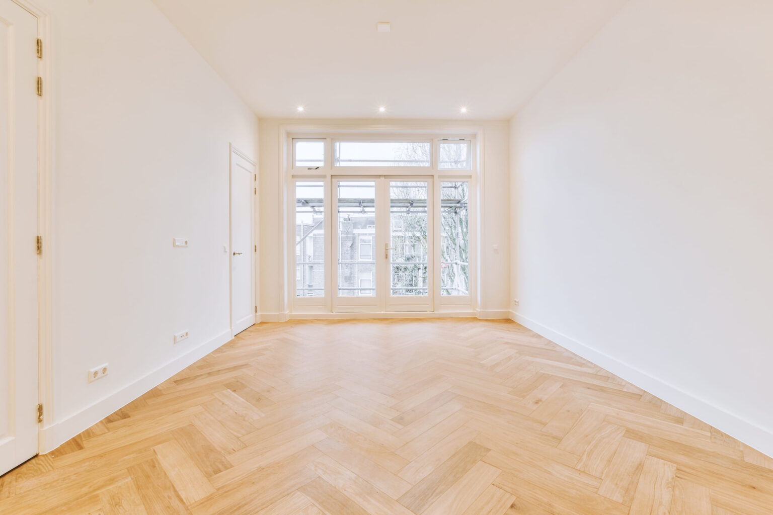 interior-of-spacious-empty-room-with-windows-2025-02-09-23-56-13-utc